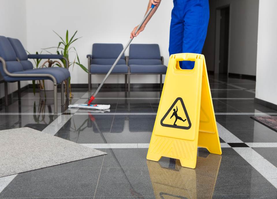 Cleaning the floor of a business office